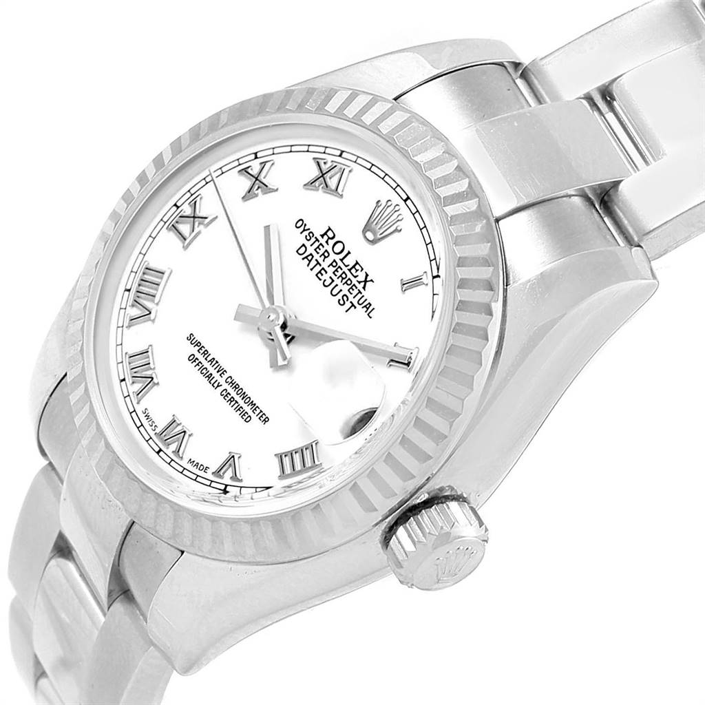 The image shows a close-up angled view of a Rolex Datejust 179174 Women's Stainless Steel White Dial 179174 Women's Stainless Steel White Dial watch face, bezel, and part of the bracelet.