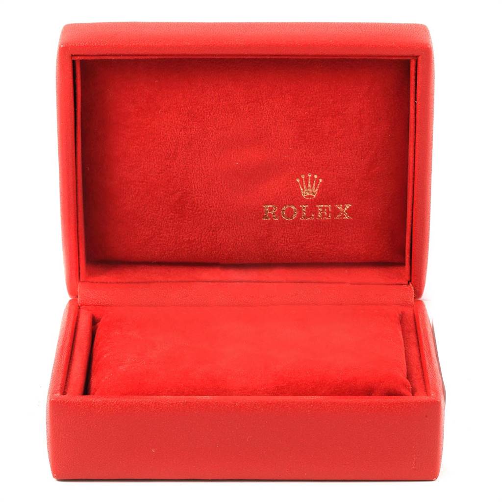 The image shows an open red Rolex watch box, with the logo and brand name on the inside fabric cover.