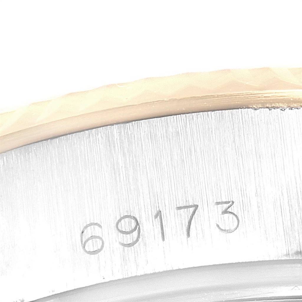This close-up image shows the model number "69173" engraved on the case of a Rolex Datejust 69173 Women's Stainless Steel Champagne Dial 69173 Women's Stainless Steel Champagne Dial watch.