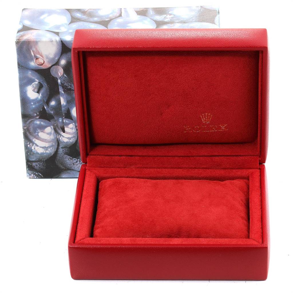 The image displays an open red Rolex watch box for a Datejust model, showing the interior pillow and branded lining.