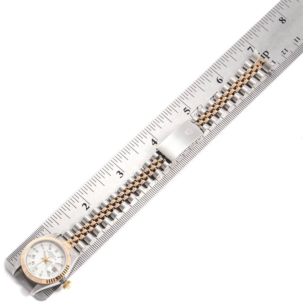 The image shows a Rolex Datejust 69173 Women's Stainless Steel White Dial 69173 Women's Stainless Steel White Dial watch from a top view, featuring the face and bracelet alongside a measuring ruler.