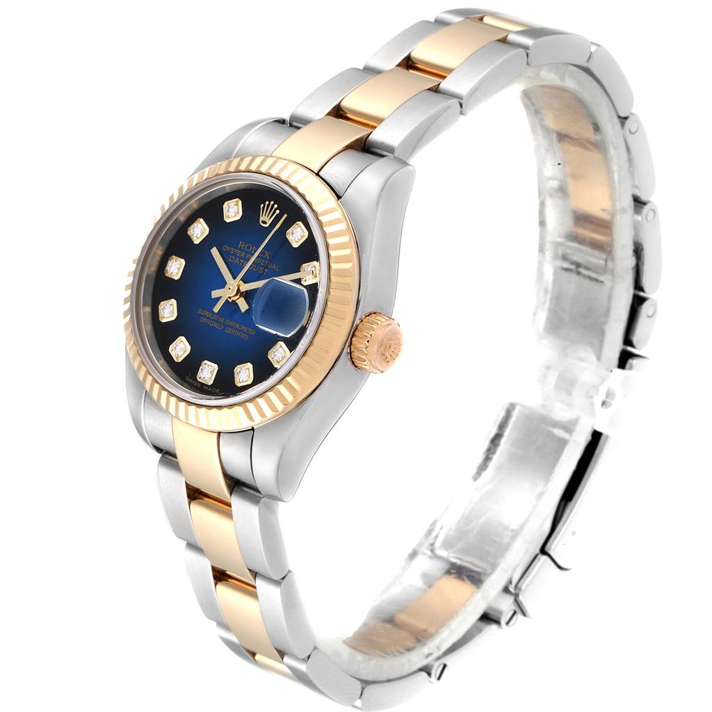 The Rolex Datejust 179173 Women's Steel and Gold (two tone) Blue Dial 179173 Women's Steel and Gold (two tone) Blue Dial watch is shown at an angled side view, displaying the dial, bezel, crown, and bracelet.