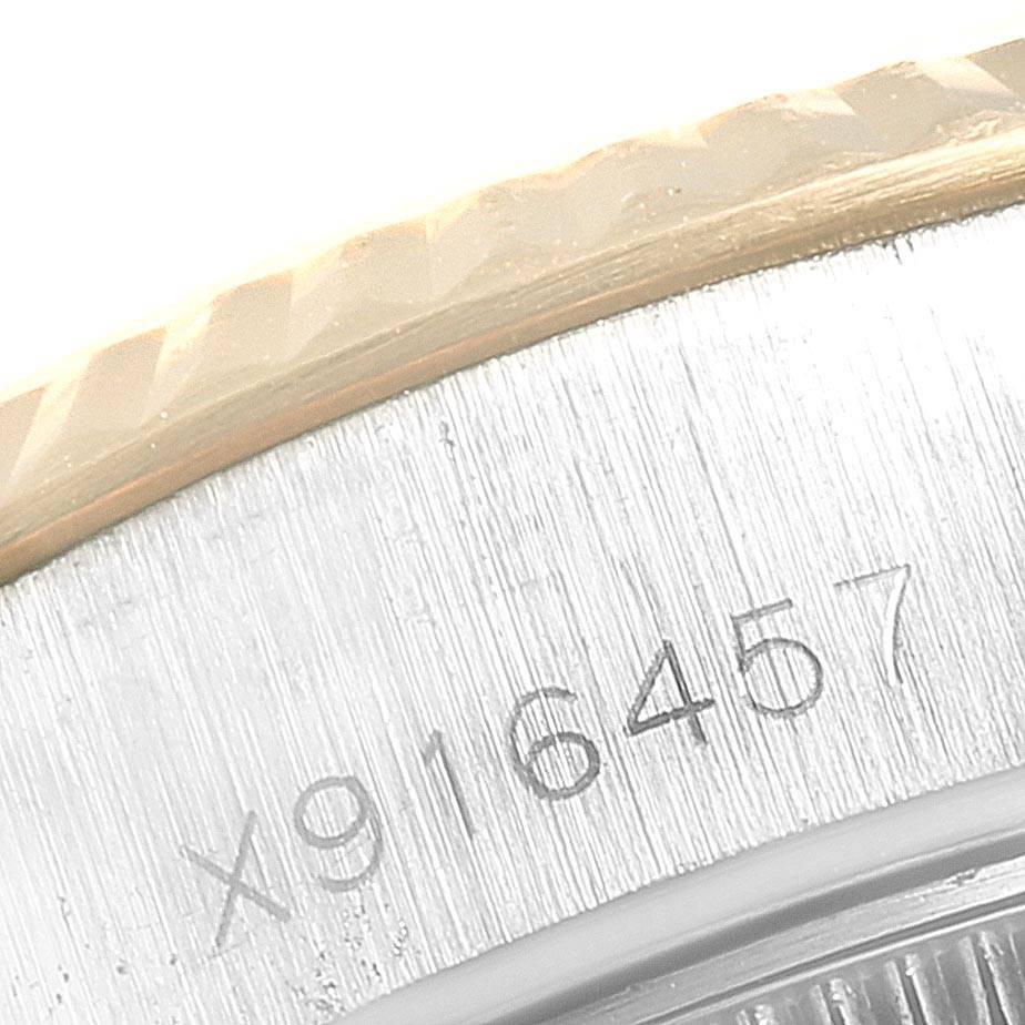 The image shows a close-up of the serial number engraving on the side of a Rolex Datejust 69173 Women
s Stainless Steel Champagne Dial 69173 Women
s Stainless Steel Champagne Dial model watch.