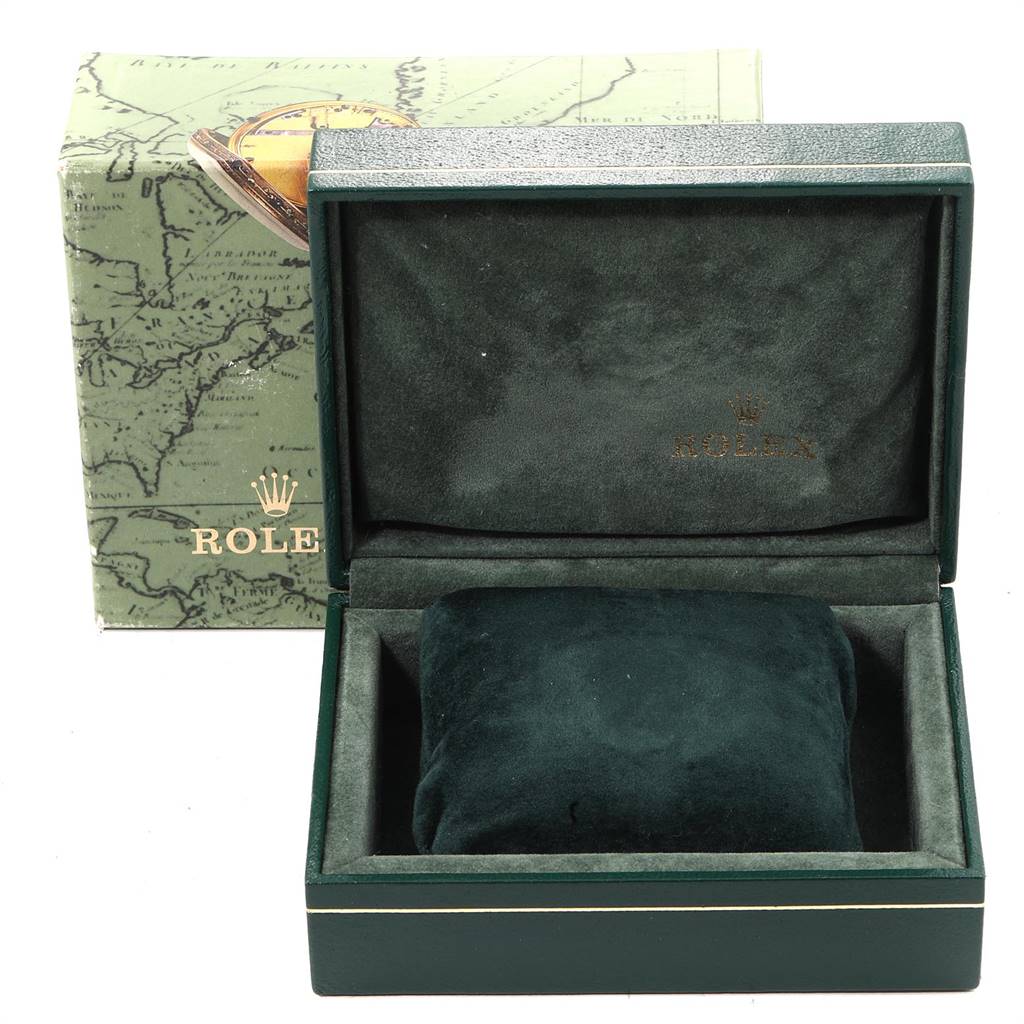 This image shows an open Rolex Datejust 69173 Women
s Stainless Steel Champagne Dial 69173 Women
s Stainless Steel Champagne Dial watch box with a pillow insert, placed in front of its outer packaging.