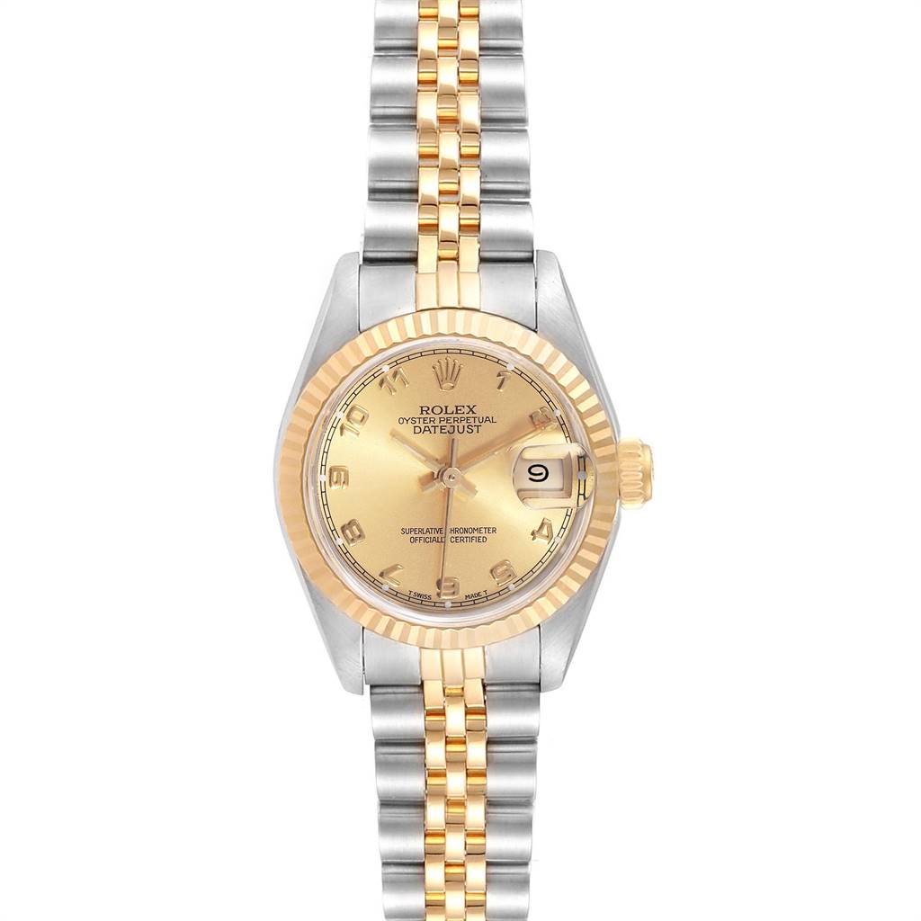 The image shows a Rolex Datejust 69173 Women
s Stainless Steel Champagne Dial 69173 Women
s Stainless Steel Champagne Dial watch from a top-down angle, displaying its gold and silver bracelet, gold dial, and fluted bezel.