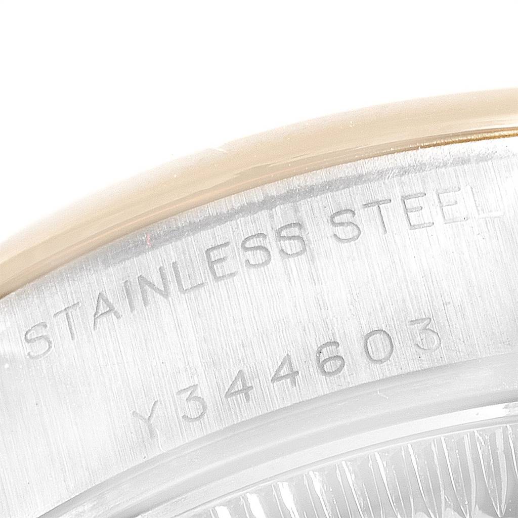 This image shows a close-up of the serial number and "Stainless Steel" inscription on the case back rim of a Rolex Datejust 79163 Women's Steel and Gold (two tone) Silver Dial 79163 Women's Steel and Gold (two tone) Silver Dial watch.
