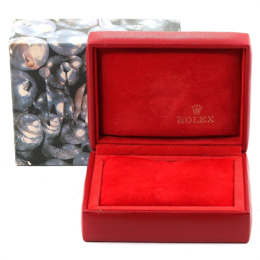 The image shows an open red Rolex watch box, likely for the Datejust model, with a logo visible on the interior.