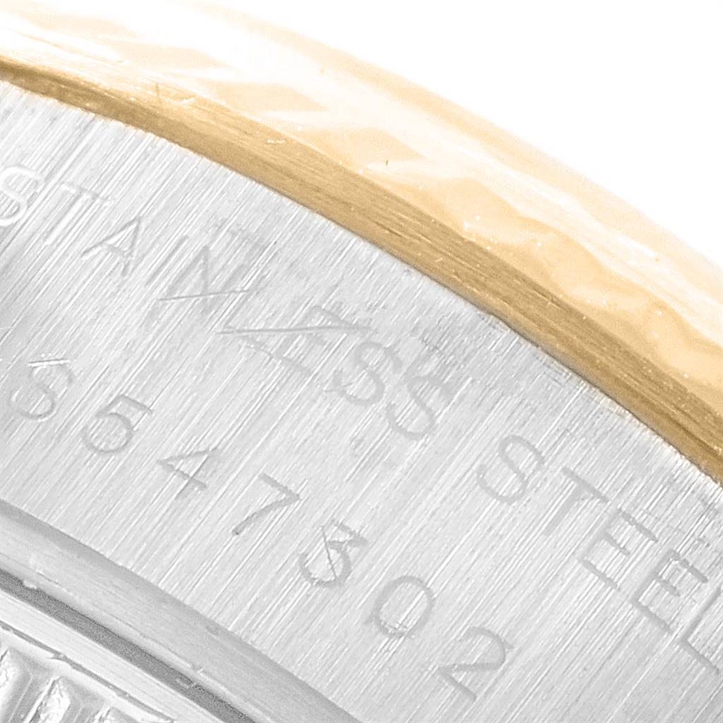 The image shows a close-up of the engraved serial number on the case back edge of a Rolex Datejust 69173 Women's Stainless Steel White Dial 69173 Women's Stainless Steel White Dial watch.
