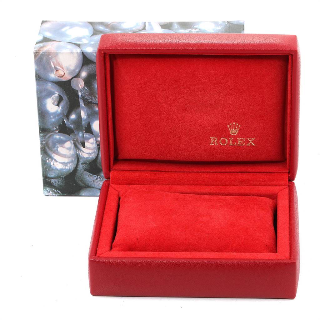 The image shows a red Rolex Datejust 79174 Women's Stainless Steel Pink Dial 79174 Women's Stainless Steel Pink Dial watch box with a cushion inside and the Rolex logo on the inner lid.