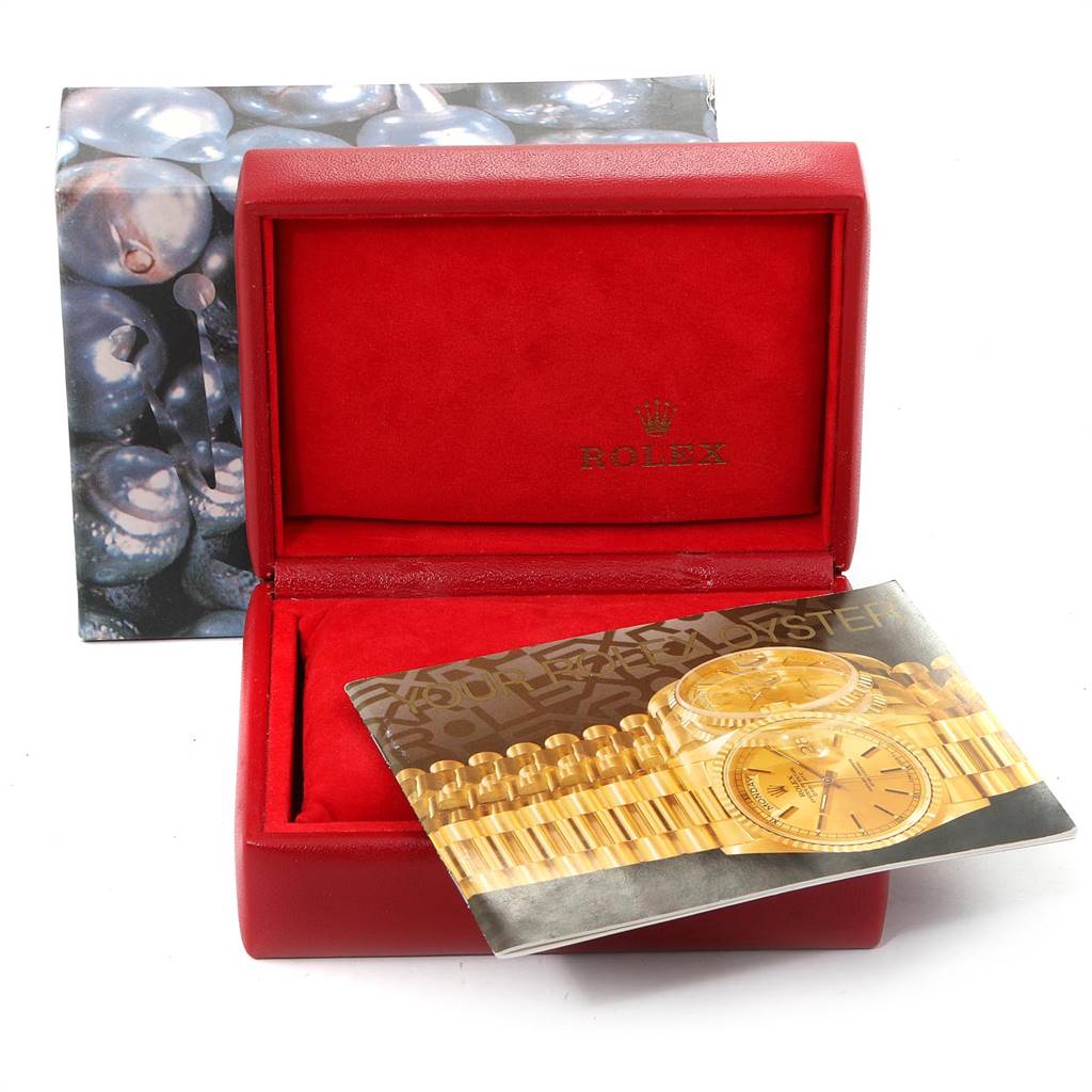 The image shows a Rolex Datejust 79173 Women
s Steel and Gold (two tone) Champagne Dial 79173 Women
s Steel and Gold (two tone) Champagne Dial watch box and a booklet featuring the watch, viewed from the front.