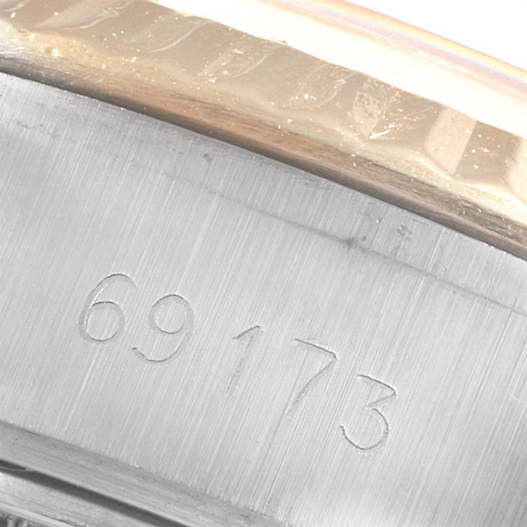 The image shows a close-up of the serial number engraving on the Rolex Datejust 69173 Women's Stainless Steel White Dial 69173 Women's Stainless Steel White Dial model watch case.