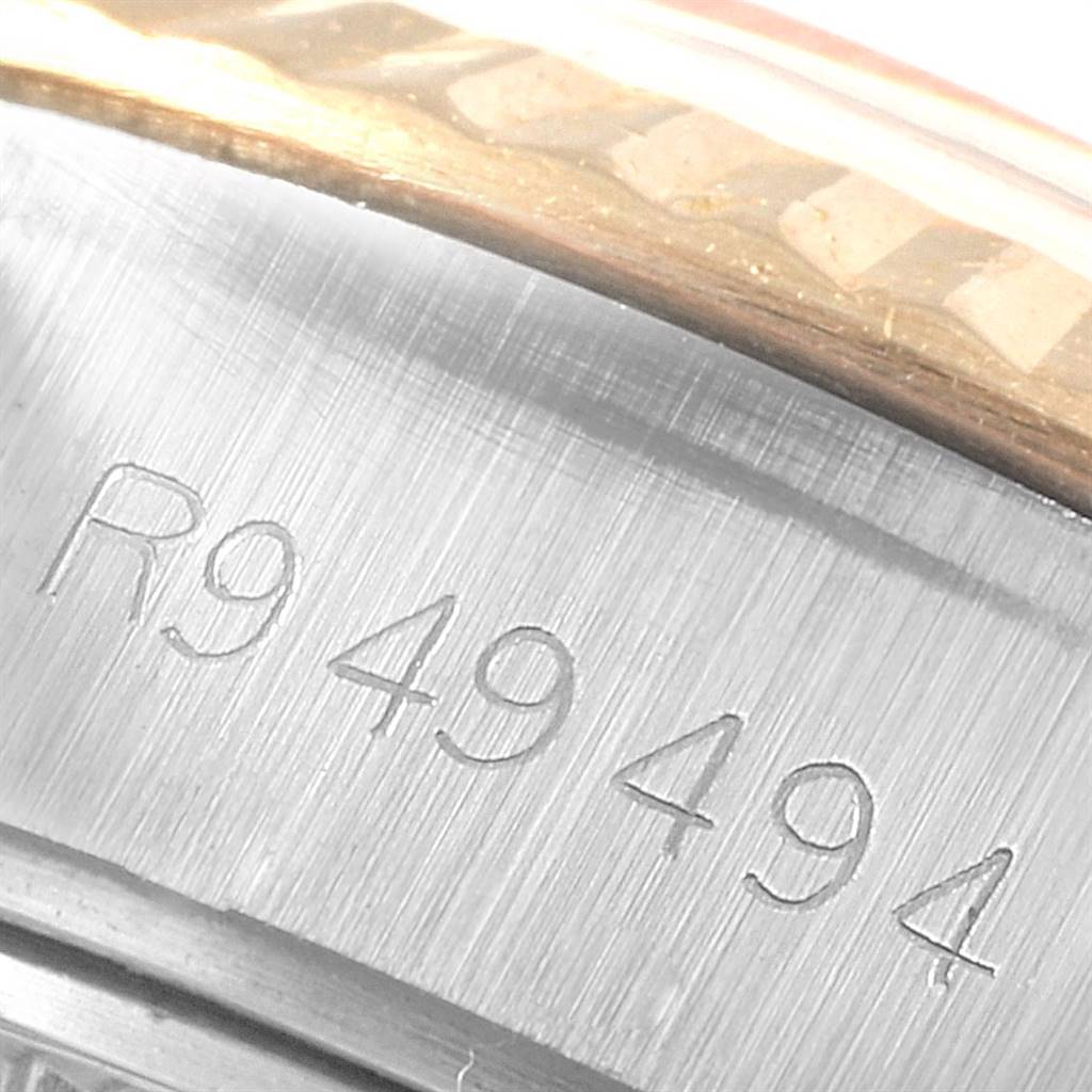 This image shows a close-up of the serial number engraved on the side of the casing of a Rolex Datejust 69173 Women's Stainless Steel White Dial 69173 Women's Stainless Steel White Dial watch.