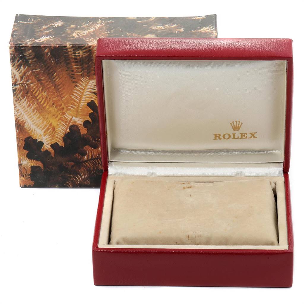 The image shows an open Rolex Datejust 69173 Women's Stainless Steel White Dial 69173 Women's Stainless Steel White Dial watch box with the brand's logo inside and an outer decorative cardboard box in the background.