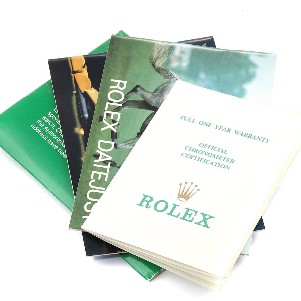 The image shows booklets and warranty cards for the Rolex Datejust 69173 Women's Stainless Steel White Dial 69173 Women's Stainless Steel White Dial model.