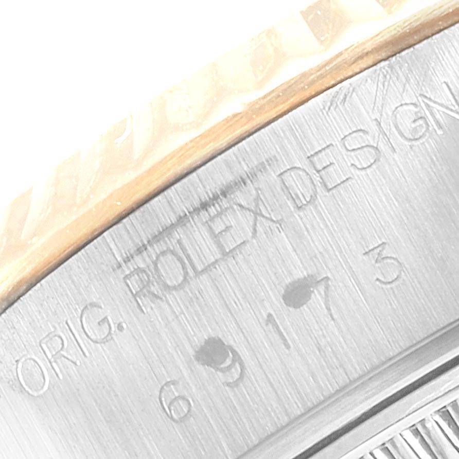 This close-up image shows the model number and branding on the case edge of a Rolex Datejust 69173 Women's Stainless Steel Beige Dial 69173 Women's Stainless Steel Beige Dial watch.