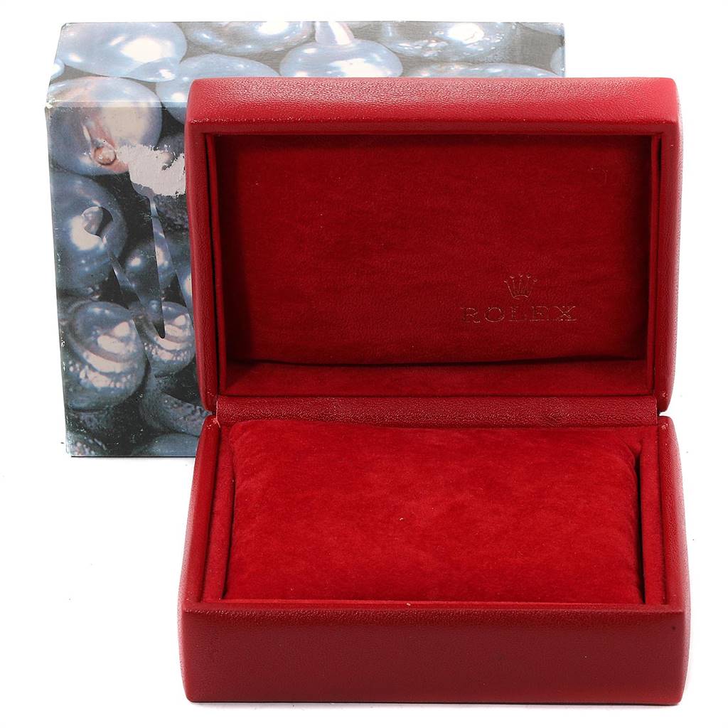 The image shows an open, empty red Rolex Datejust 79174 Women
s Stainless Steel White Dial 79174 Women
s Stainless Steel White Dial watch box with a decorative outer box in the background.
