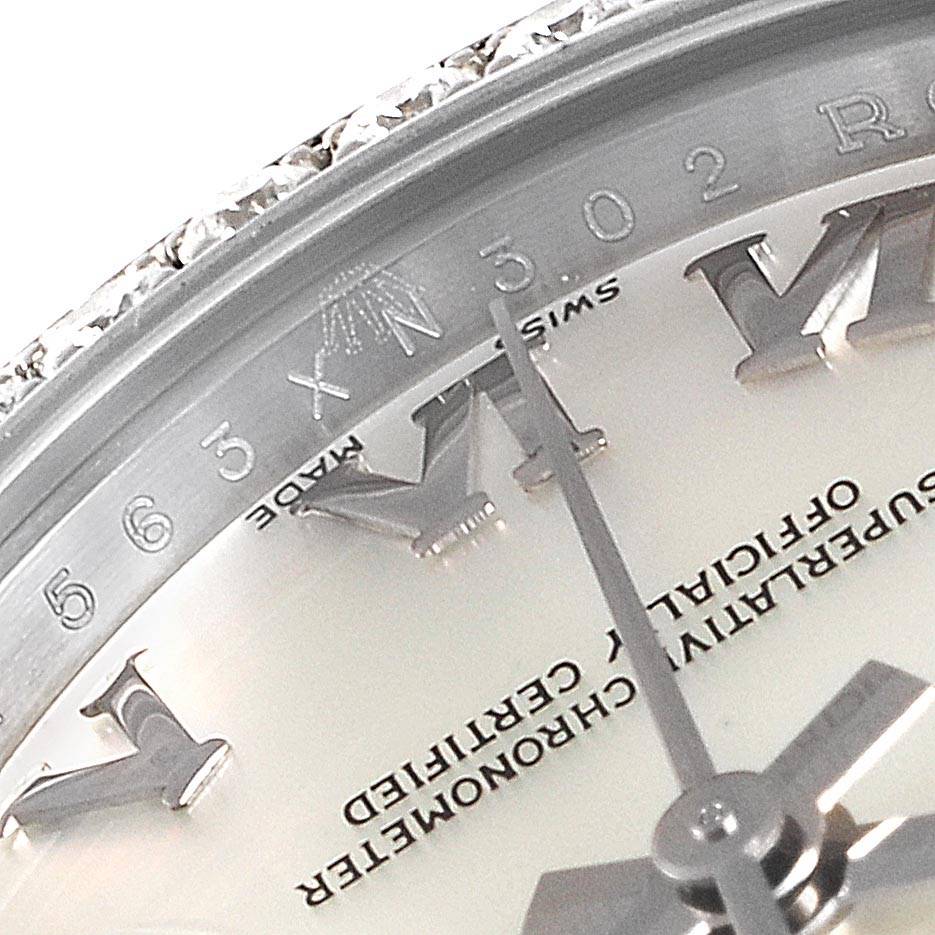 The image shows a close-up of the dial, Roman numerals, and the minute and hour hands of a Rolex Datejust 179384 Women's Stainless Steel Mother of Pearl Dial 179384 Women's Stainless Steel Mother of Pearl Dial watch.