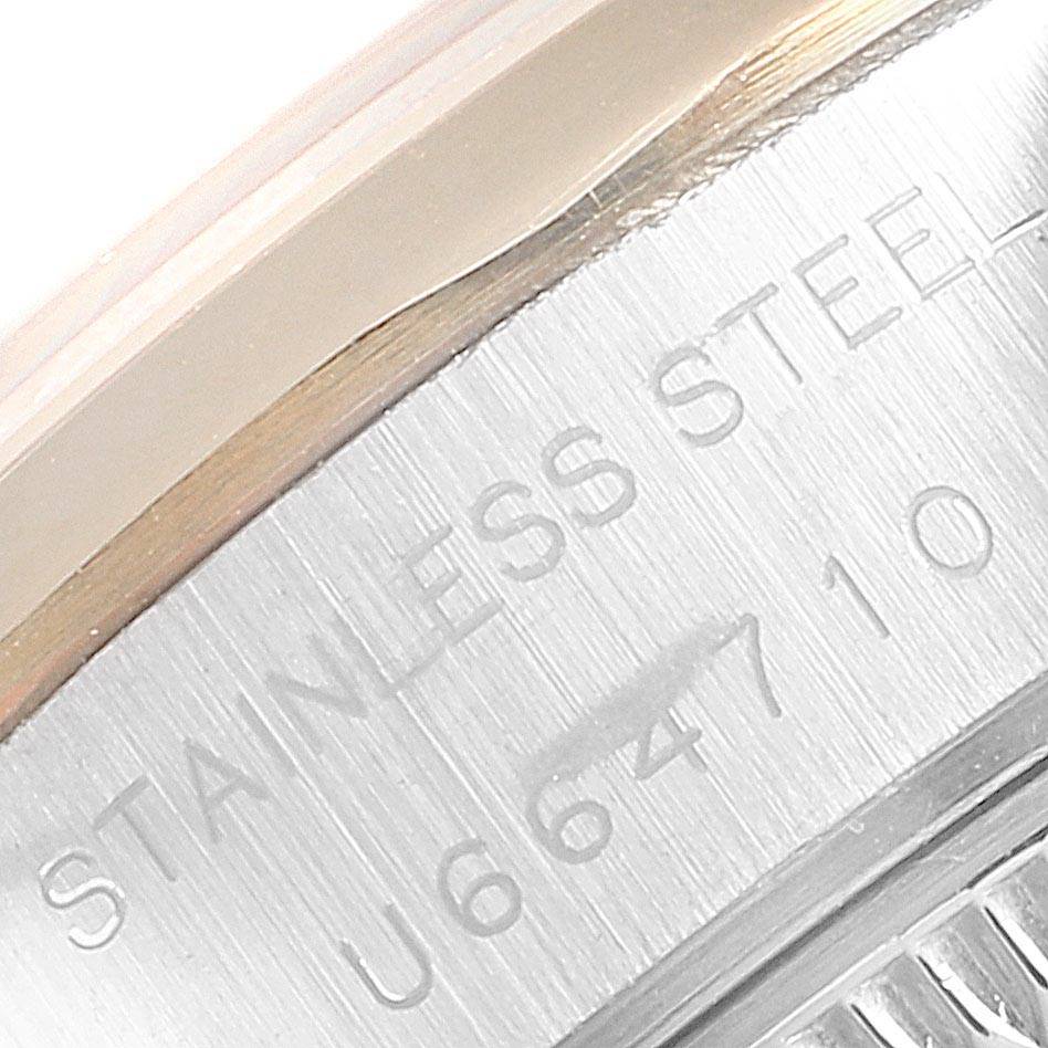 This image shows a close-up view of the serial number inscribed on the stainless steel back of a Rolex Datejust 69163 Women's Stainless Steel Grey Dial 69163 Women's Stainless Steel Grey Dial watch.