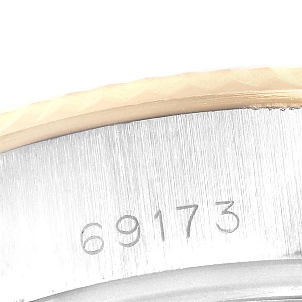 The image shows a close-up of the case back and serial number engraving of a Rolex Datejust 69173 Women's Stainless Steel White Dial 69173 Women's Stainless Steel White Dial model watch.