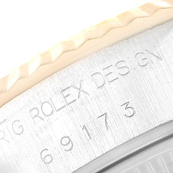 The image shows a close-up angle of the model number and "ROLEX" engraving on the bezel of a Rolex Datejust 69173 Women's Steel and Gold (two tone) White Dial 69173 Women's Steel and Gold (two tone) White Dial watch.