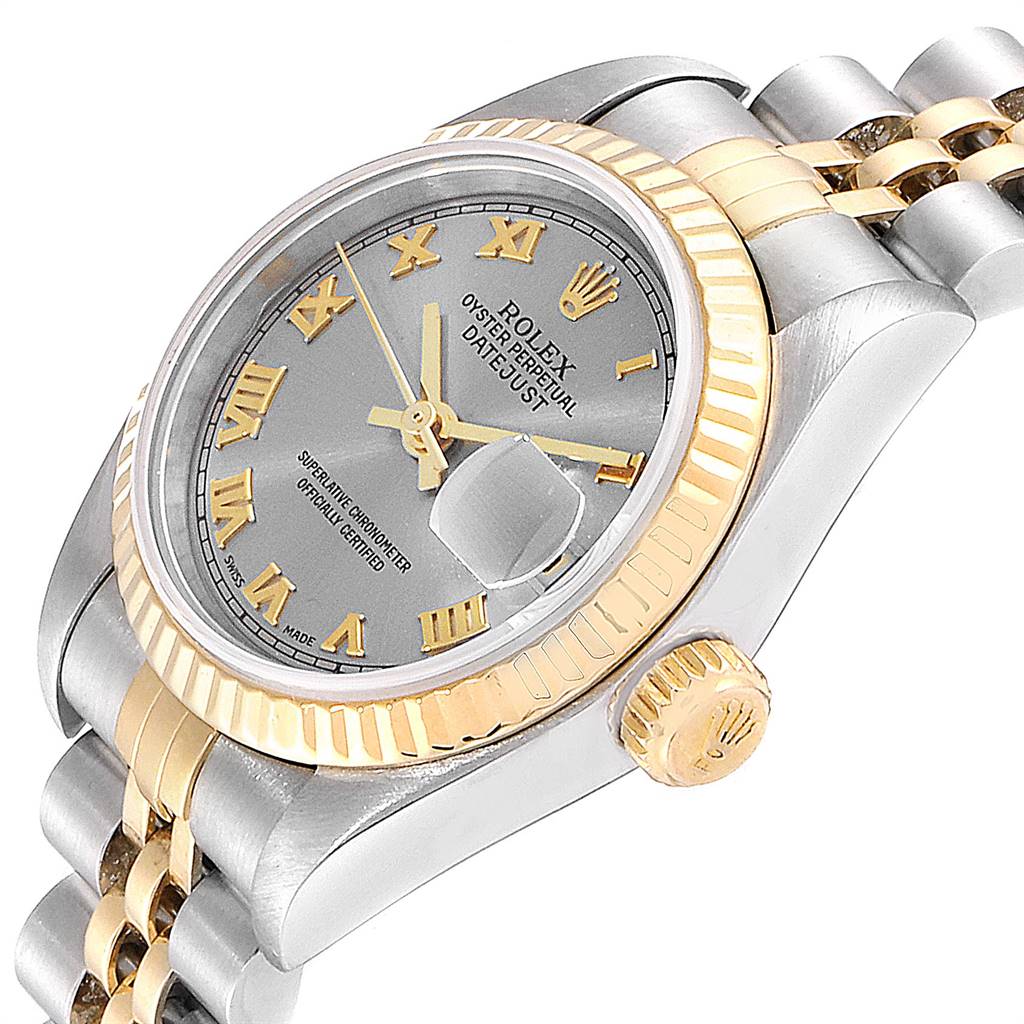 The image shows a Rolex Datejust 79173 Women
s Steel and Gold (two tone) Grey Dial 79173 Women
s Steel and Gold (two tone) Grey Dial watch at an angled side view, highlighting the dial, fluted bezel, and part of the bracelet.