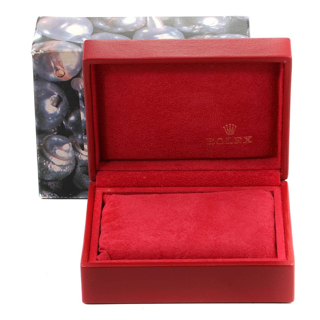 The image shows an open red Rolex Datejust 69173 Women's Stainless Steel Champagne Dial 69173 Women's Stainless Steel Champagne Dial watch box, highlighting its interior padding and branding.