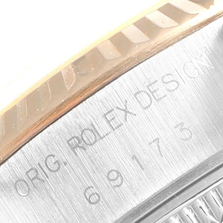 This close-up image shows part of the bezel and the engraved model number on a Rolex Datejust 69173 Women's Stainless Steel Beige Dial 69173 Women's Stainless Steel Beige Dial watch.
