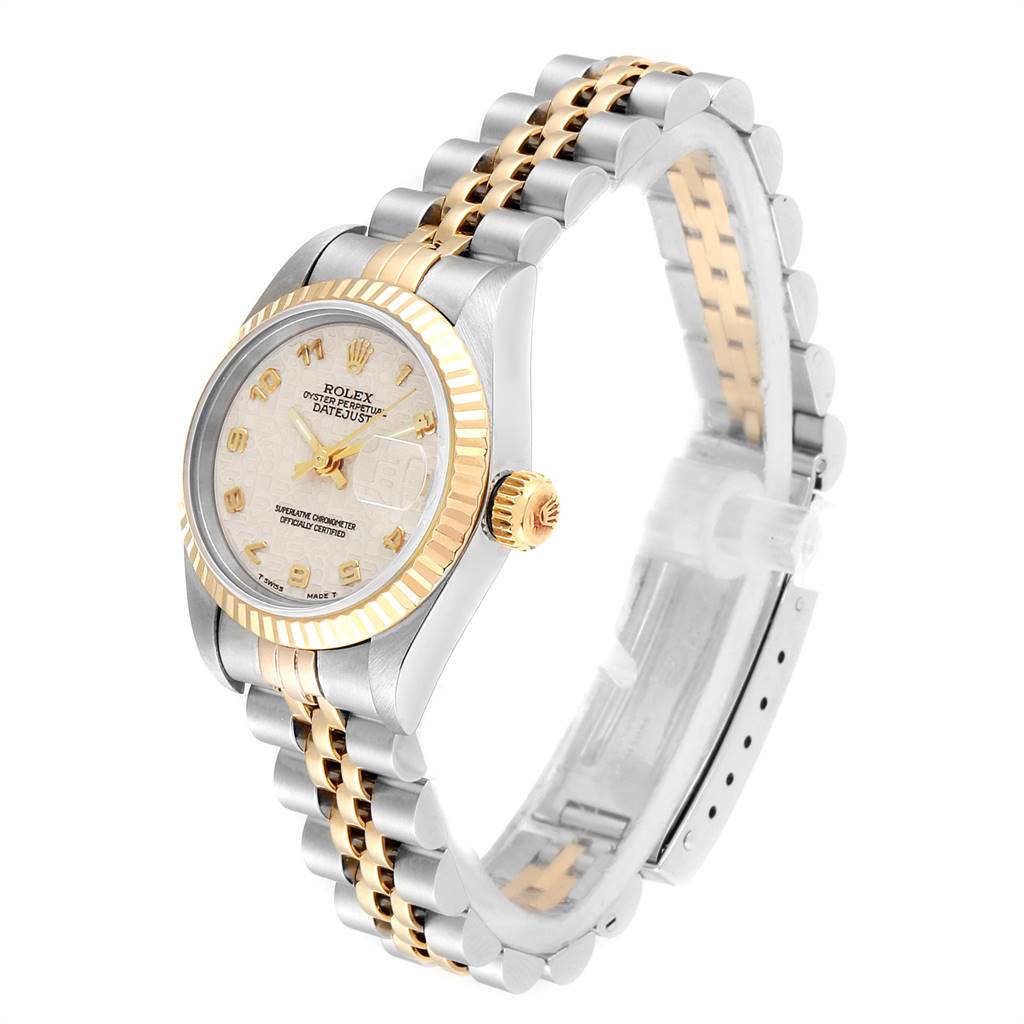 The Rolex Datejust 69173 Women's Stainless Steel Beige Dial 69173 Women's Stainless Steel Beige Dial watch is shown at a tilted angle, displaying its dial, bezel, and bracelet.