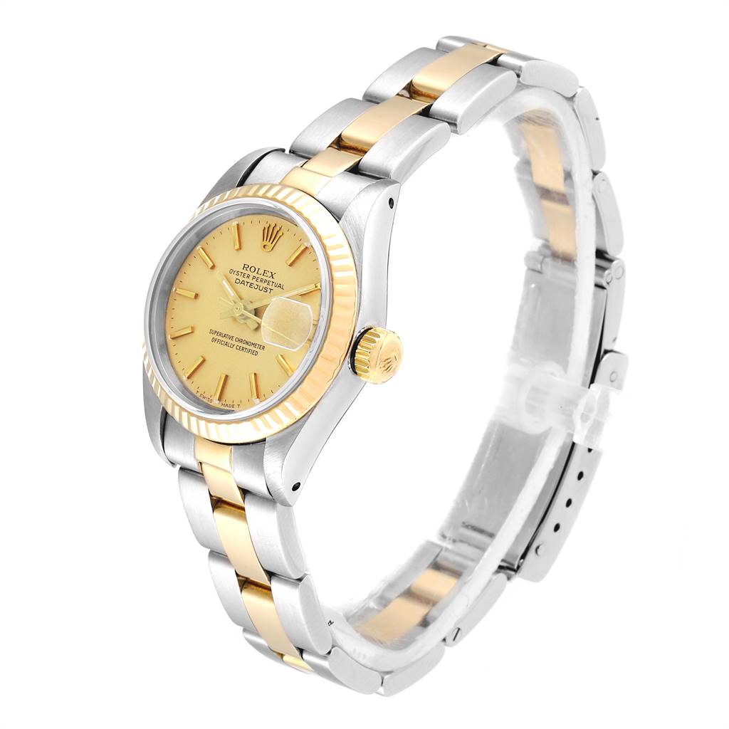 The Rolex Datejust 69173 Women's Stainless Steel Champagne Dial 69173 Women's Stainless Steel Champagne Dial watch is shown at an angle, highlighting the dial, fluted bezel, crown, and two-tone bracelet.