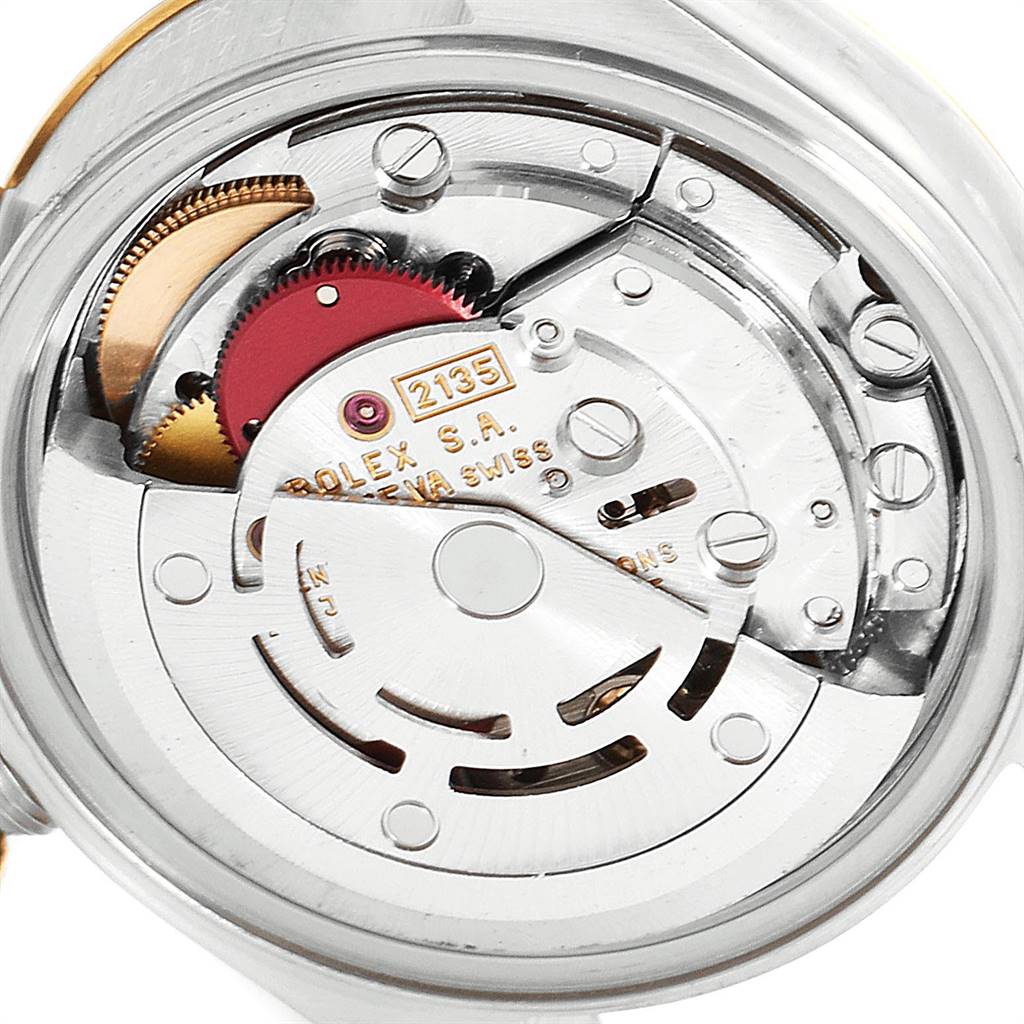 This is a close-up image of the movement mechanism inside the Rolex Datejust 69173 Women's Steel and Gold (two tone) Champagne Dial 69173 Women's Steel and Gold (two tone) Champagne Dial watch, highlighting gears and components.