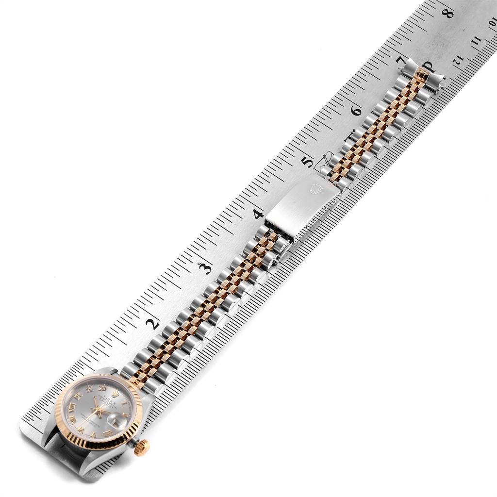 This image shows a Rolex Datejust 69173 Women's Stainless Steel Silver Dial 69173 Women's Stainless Steel Silver Dial watch laid out flat next to a ruler, highlighting the bracelet and clasp.