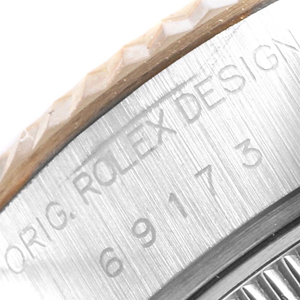 The image shows a close-up of the engraved caseback edge and bezel of a Rolex Datejust 69173 Women's Stainless Steel Silver Dial 69173 Women's Stainless Steel Silver Dial watch.
