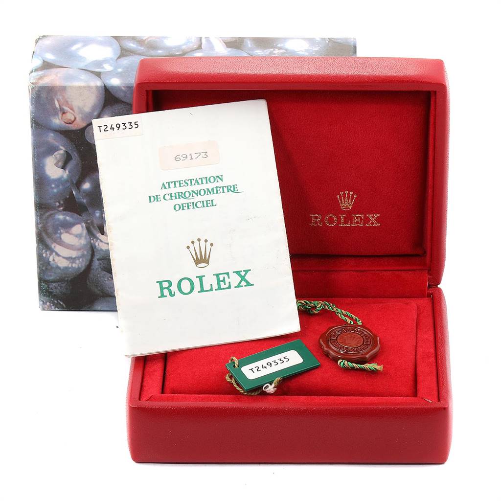 The image shows the box, manual, and tags for a Rolex Datejust 69173 Women's Stainless Steel Silver Dial 69173 Women's Stainless Steel Silver Dial watch, with the open box prominently displayed from the front.