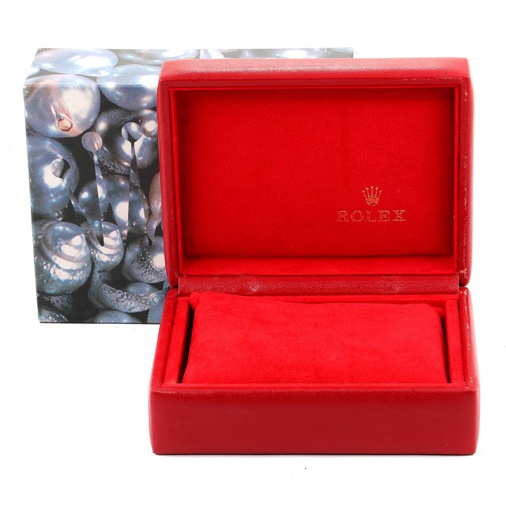 The image shows an empty red Rolex watch box, likely for a Datejust model, with a matching outer box in the background.