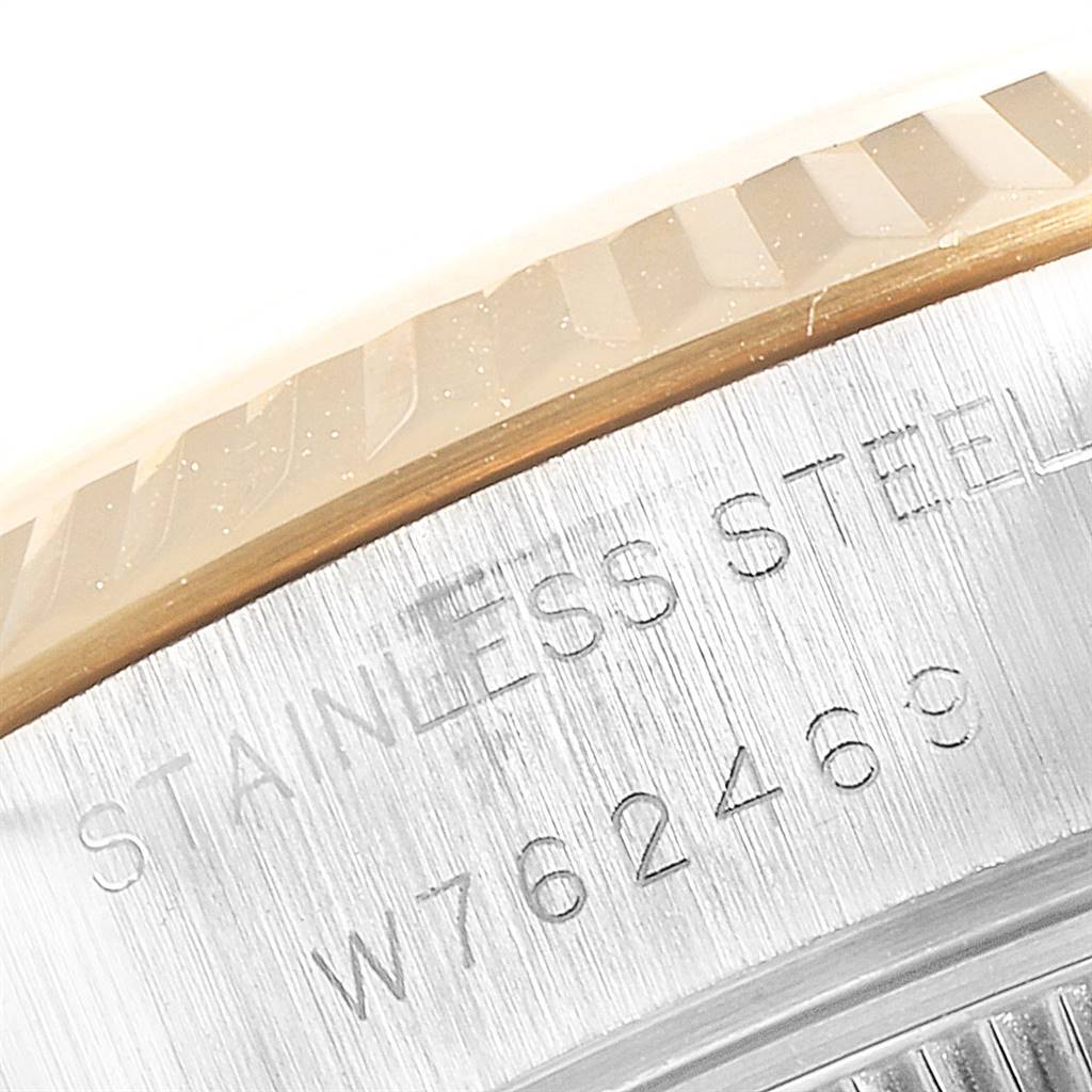The image shows a close-up angle of the serial number and "STAINLESS STEEL" engraving on a Rolex Datejust 69173 Women's Stainless Steel Silver Dial 69173 Women's Stainless Steel Silver Dial watch.