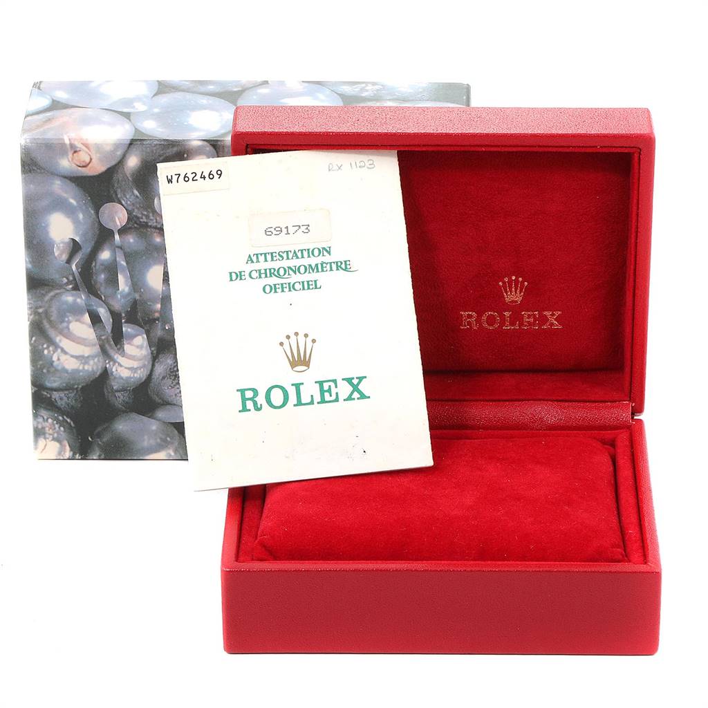 The image shows a red Rolex Datejust 69173 Women's Stainless Steel Silver Dial 69173 Women's Stainless Steel Silver Dial box with official chronometer certification papers partially inside.