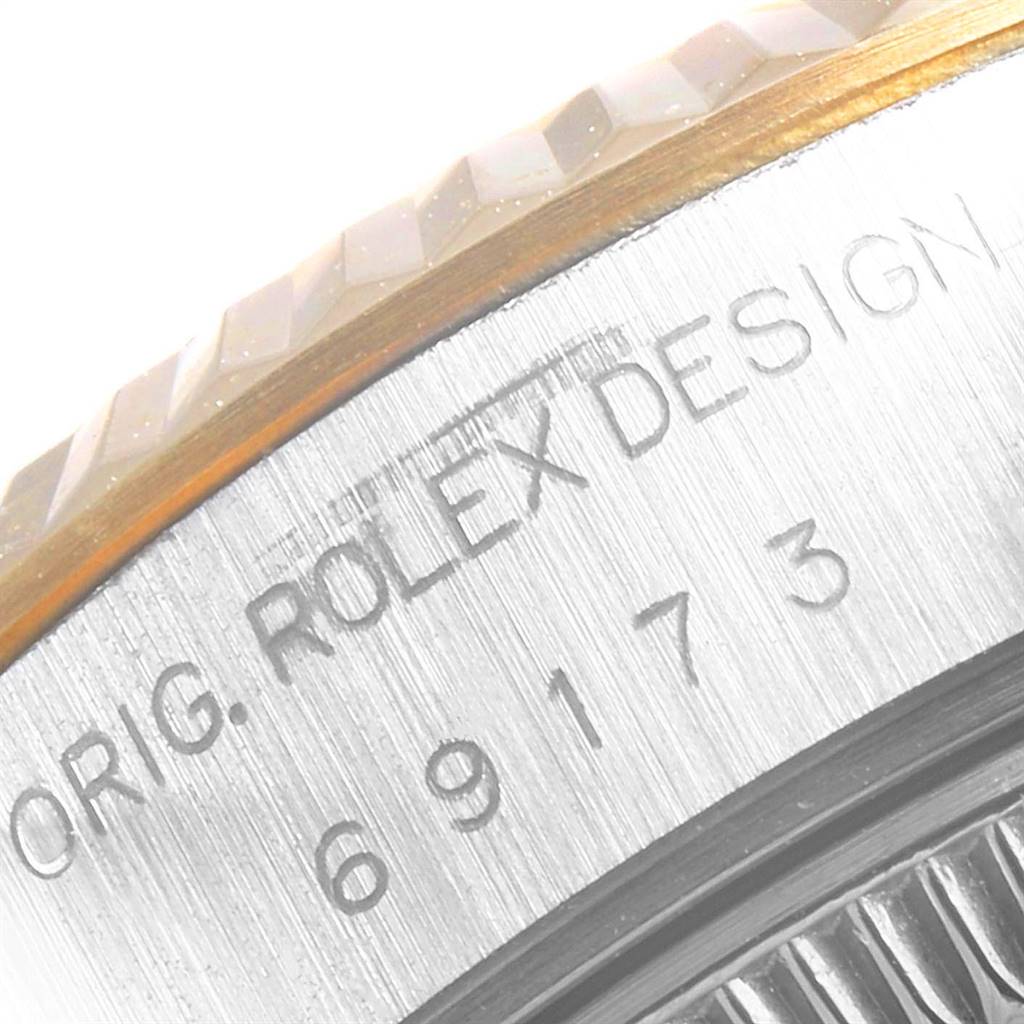 This image shows a close-up of the engraved side of the bezel and case of a Rolex Datejust 69173 Women's Stainless Steel White Dial 69173 Women's Stainless Steel White Dial watch.