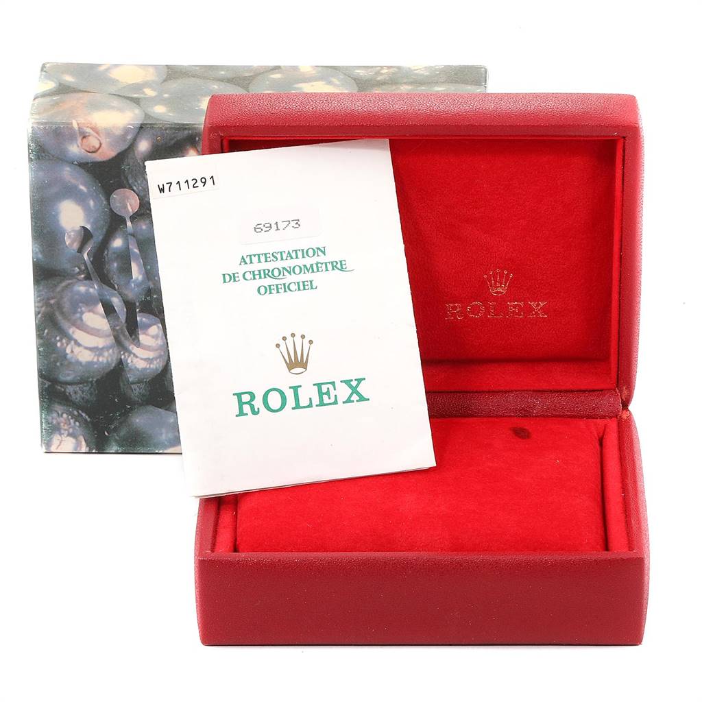This image shows Rolex Datejust 69173 Women's Stainless Steel White Dial 69173 Women's Stainless Steel White Dial accessories, including a red watch box and an official chronometer attestation.