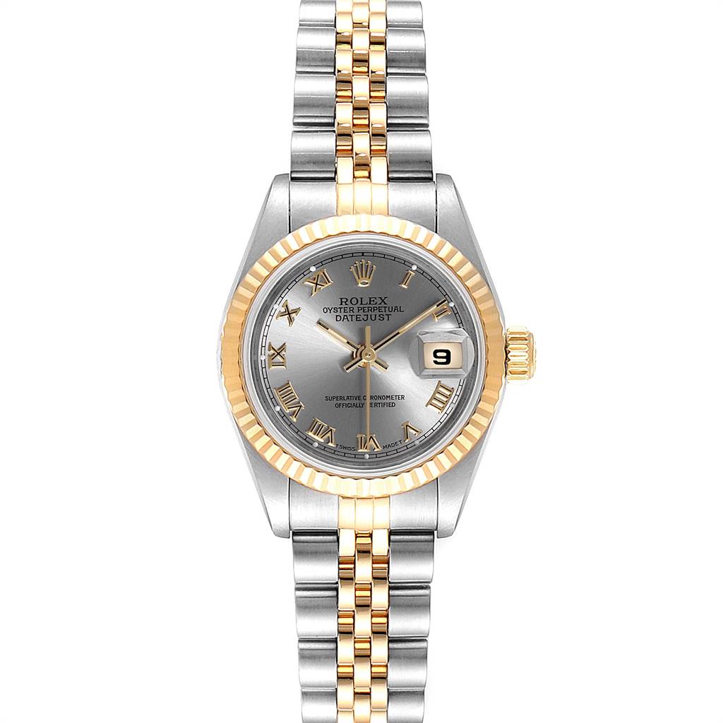 The Rolex Datejust 69173 Women
s Stainless Steel Silver Dial 69173 Women
s Stainless Steel Silver Dial watch is shown facing forward, featuring a grey dial, gold fluted bezel, and a two-tone Jubilee bracelet.