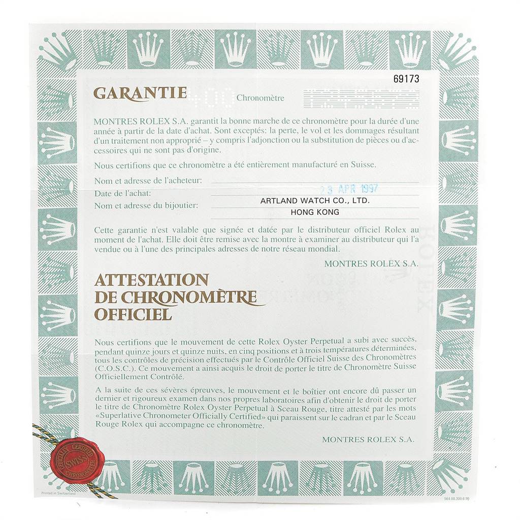 The image displays the warranty and certification papers for a Rolex Datejust 69173 Women
s Stainless Steel Silver Dial 69173 Women
s Stainless Steel Silver Dial watch from an overhead angle.