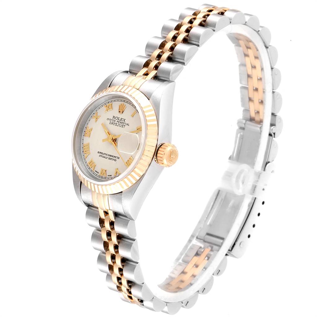 The image shows a Rolex Datejust 69173 Women
s Stainless Steel Beige Dial 69173 Women
s Stainless Steel Beige Dial watch at a slight angle, highlighting its two-tone bracelet, fluted bezel, and the face with Roman numerals.