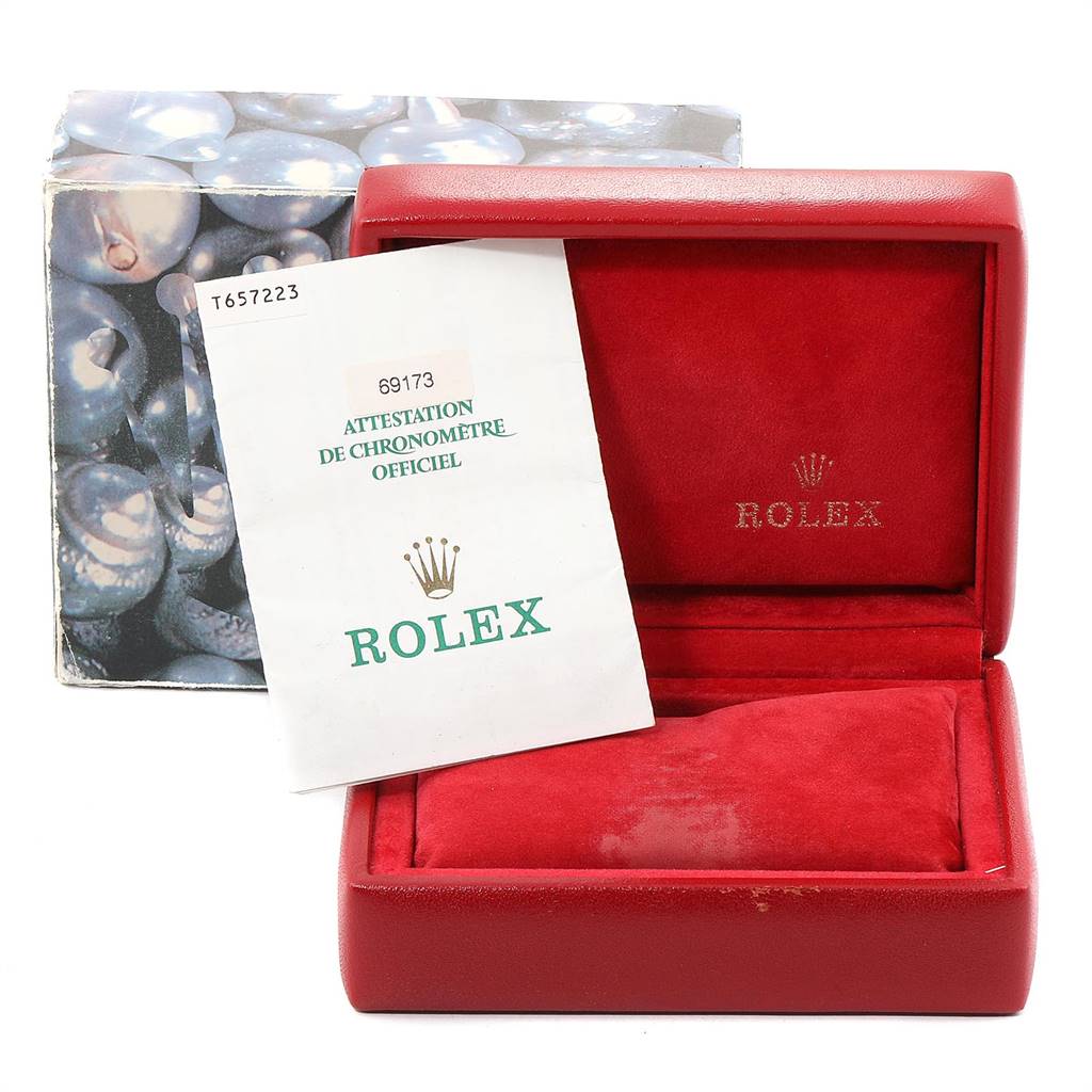 The image shows a red Rolex Datejust 69173 Women
s Stainless Steel Beige Dial 69173 Women
s Stainless Steel Beige Dial watch box with an official chronometer certificate booklet.