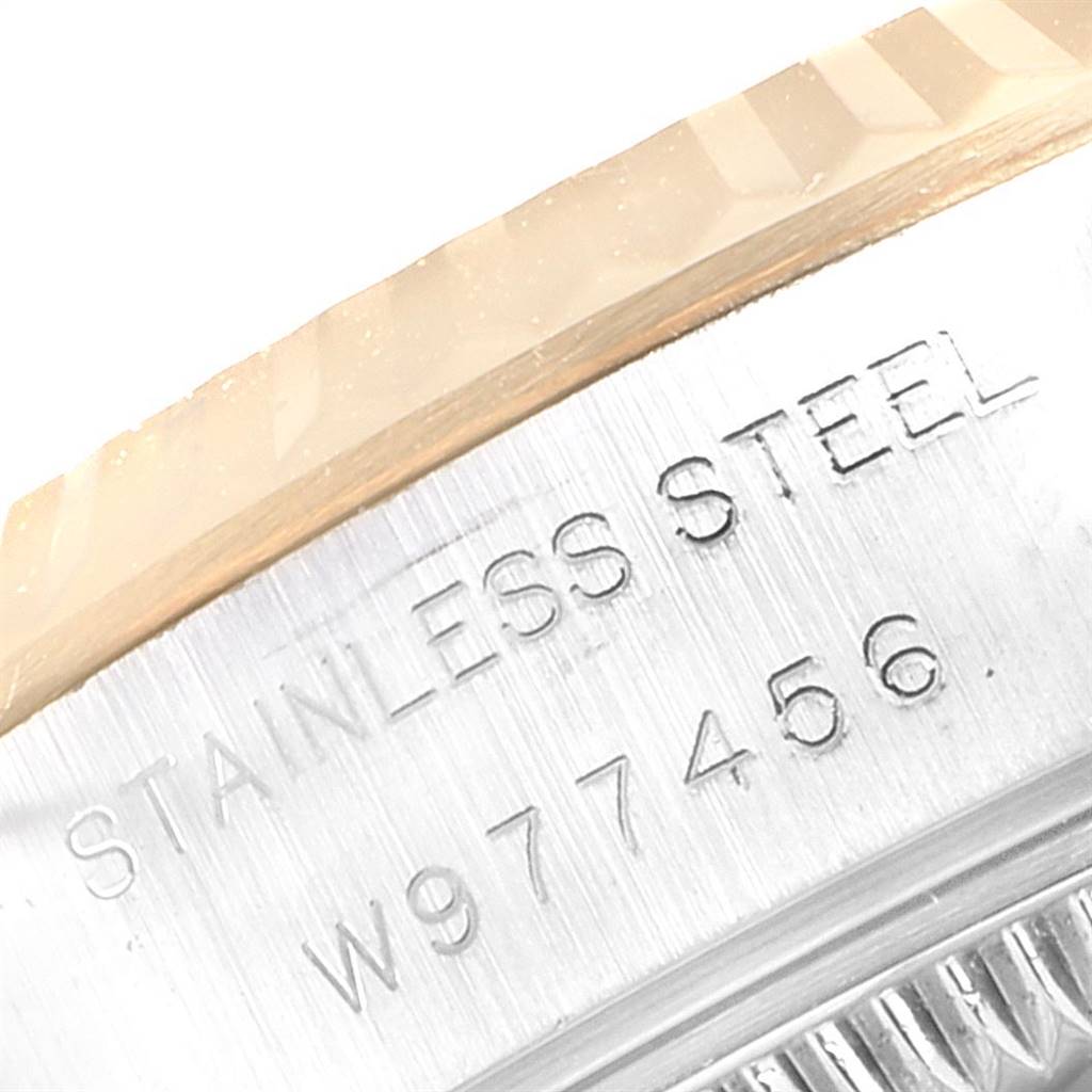 This close-up image shows the stainless steel case and serial number of a Rolex Datejust 69173 Women's Stainless Steel White Dial 69173 Women's Stainless Steel White Dial watch.