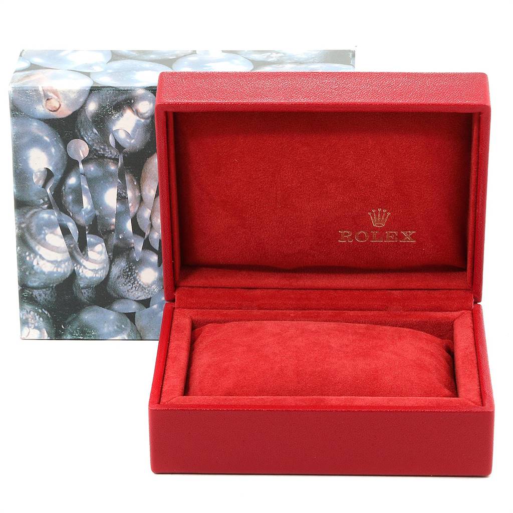 This image shows a red Rolex Datejust 69173 Women's Stainless Steel White Dial 69173 Women's Stainless Steel White Dial watch box, opened, with a protective pillow inside and a decorative outer box in the background.