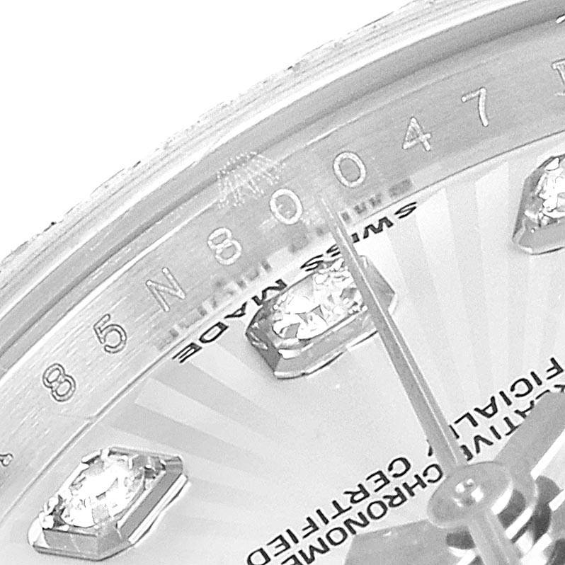 This image shows a close-up of the dial and flange of a Rolex Datejust 179384 Women's Stainless Steel Silver Dial 179384 Women's Stainless Steel Silver Dial watch, highlighting diamond hour markers and engravings.