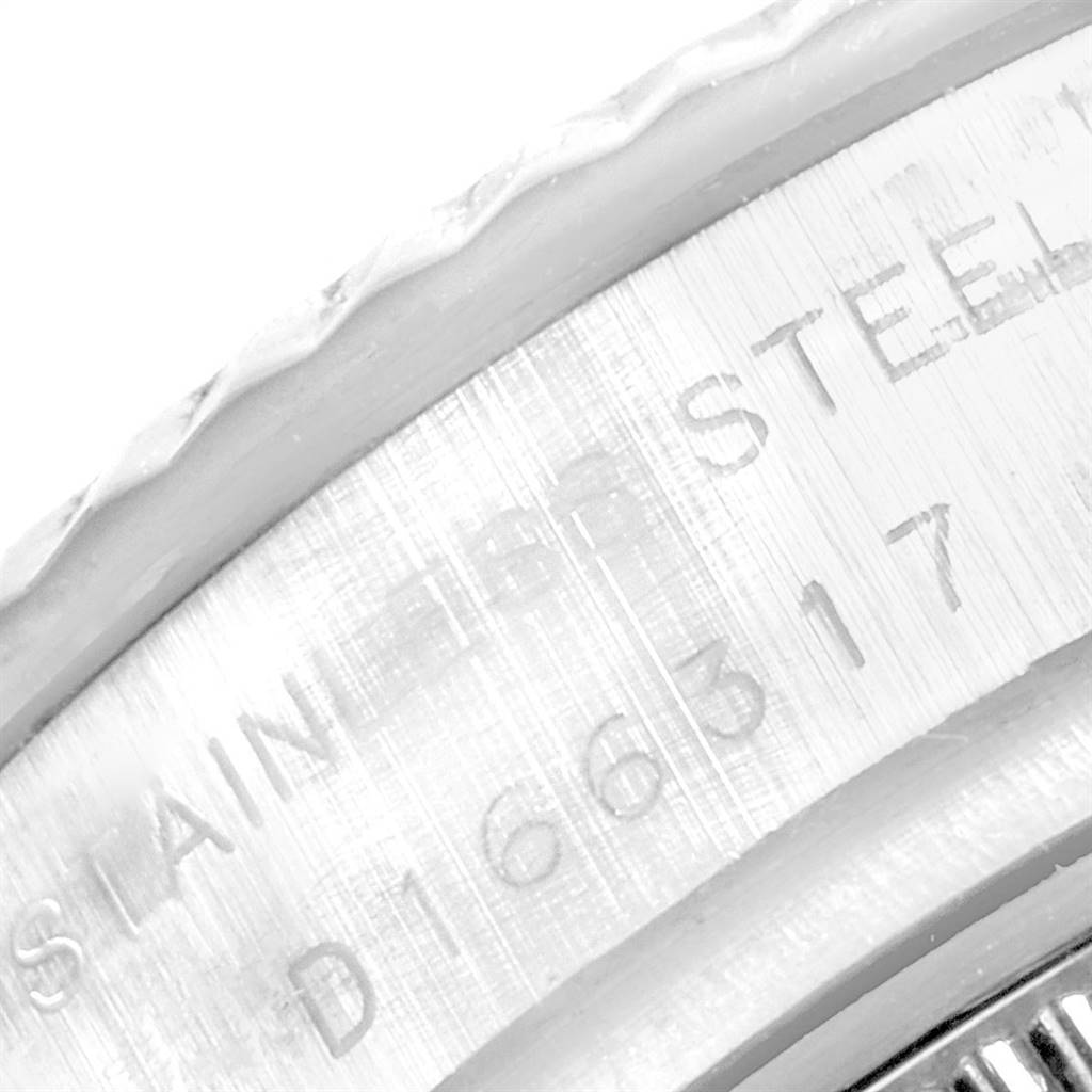 The image shows a close-up of the side engraving on the stainless steel case of a Rolex Datejust 179174 Women's Stainless Steel Grey Dial 179174 Women's Stainless Steel Grey Dial watch.