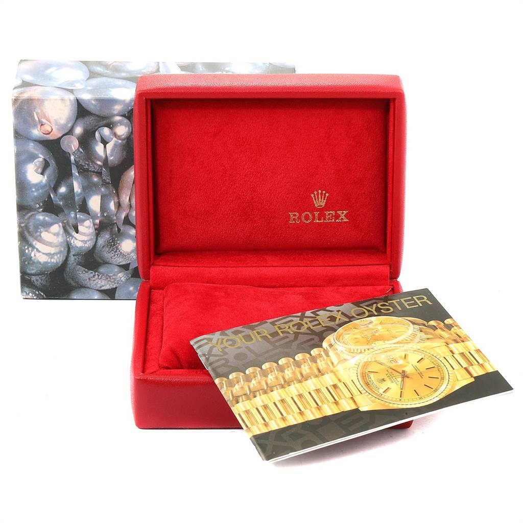 This image shows an empty Rolex Datejust 79174 Women's Stainless Steel Pink Dial 79174 Women's Stainless Steel Pink Dial watch box, along with an instruction booklet.