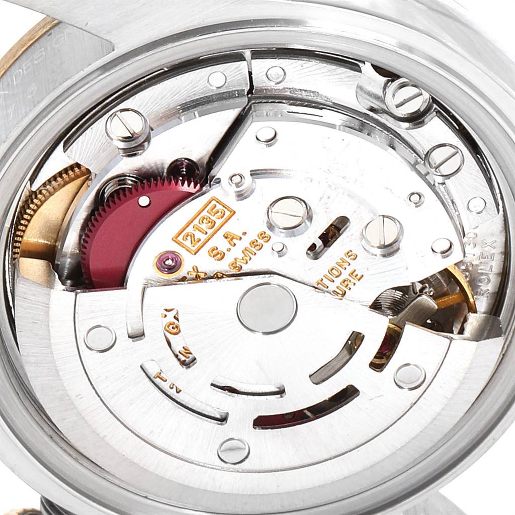 This is a close-up shot of the internal movement mechanism of a Rolex Datejust 69173 Women
s Stainless Steel White Dial 69173 Women
s Stainless Steel White Dial watch, showing its intricate components.