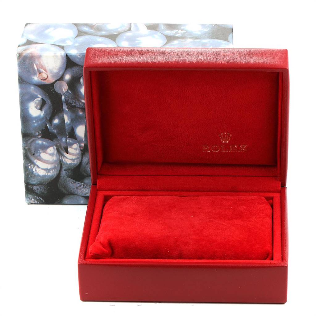 The image shows an open Rolex Datejust 69173 Women
s Stainless Steel White Dial 69173 Women
s Stainless Steel White Dial watch box in red velvet, displaying the interior and a placeholder cushion.
