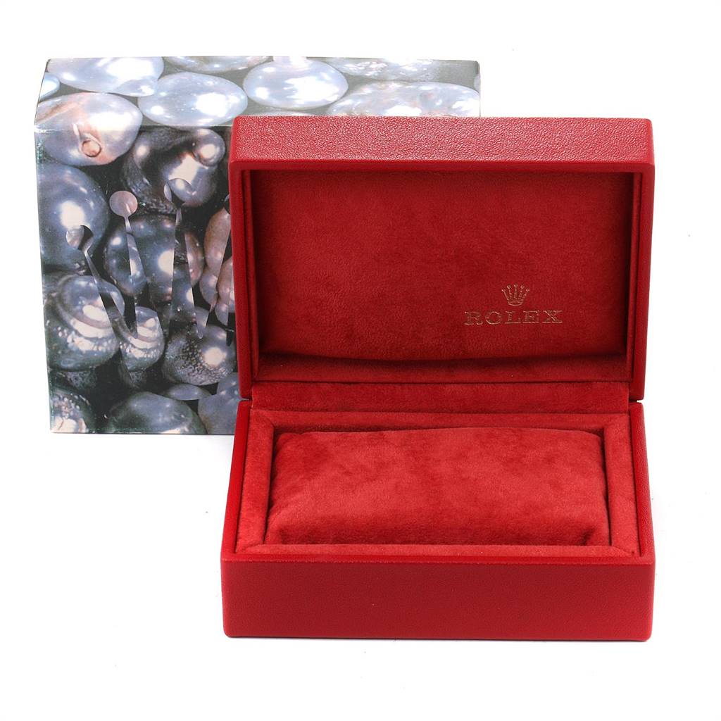 The image shows an open Rolex Datejust 69173 Women's Stainless Steel White Dial 69173 Women's Stainless Steel White Dial watch box with a red interior and an outer sleeve featuring a pearl-like pattern.